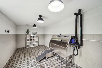 a kitchen with a stainless steel refrigerator and a stove